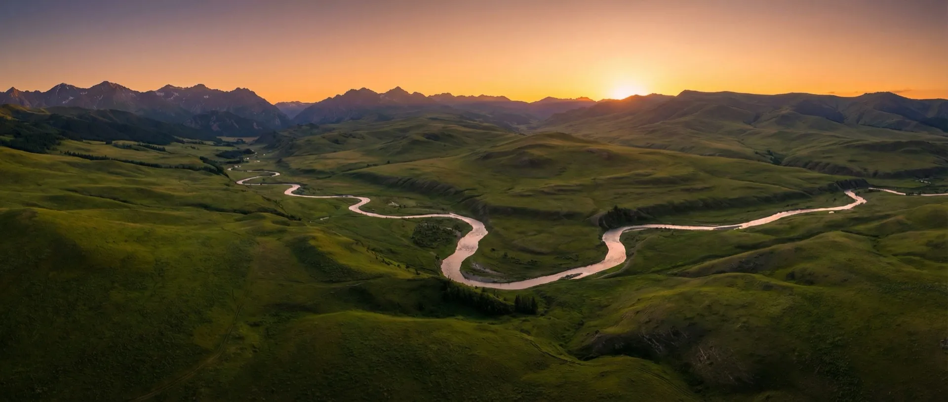 Protected land — rolling green valleys at sunset